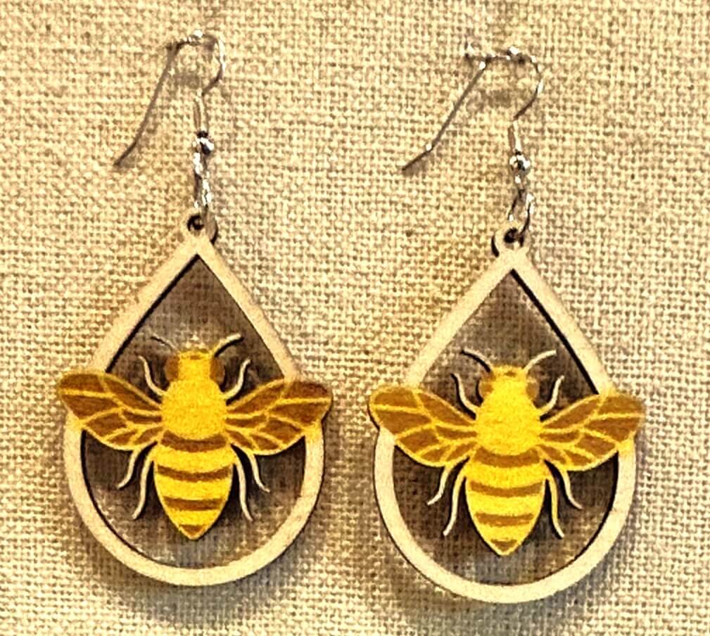 Wooden earrings with a bee in a tear drop yellow painted and natural wood